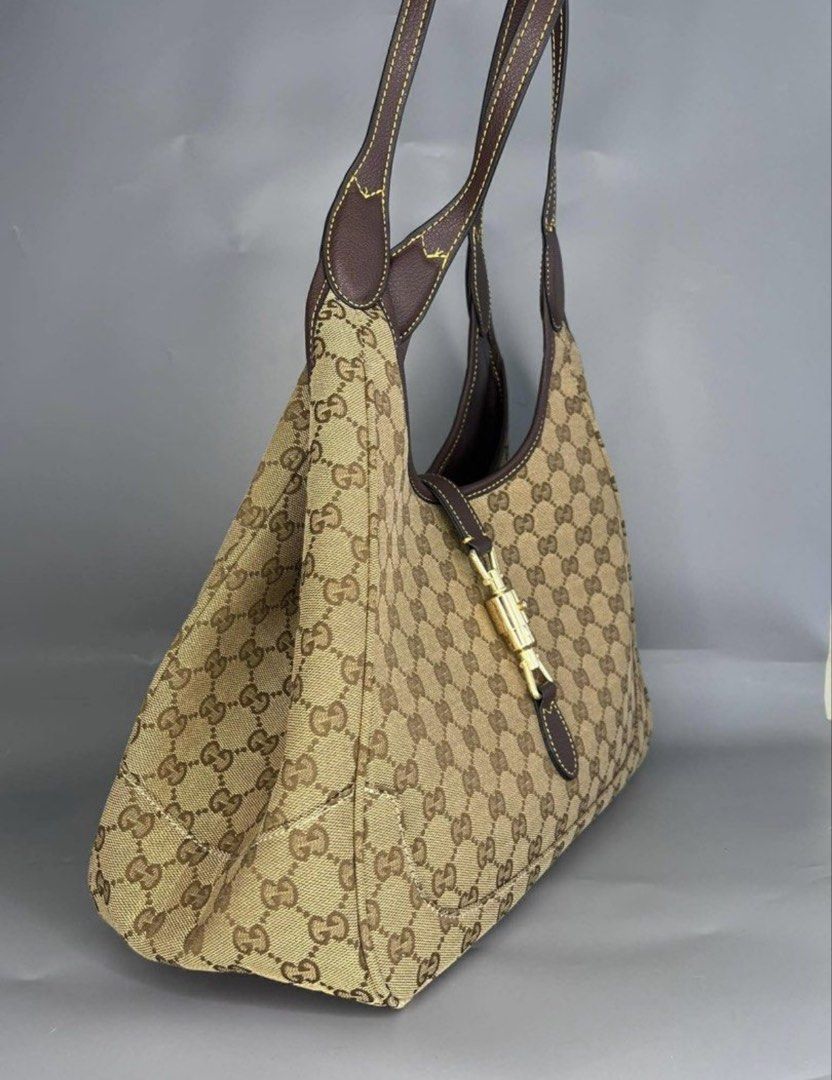 Gucci Monogram Canvas Hobo Bag (Category: Luxury Bags & Wallets) located in Manila. Submitted by cheapful (Listing ID 1460224413, Image 2). Description: - Classic Gucci hobo bag - Beige GG monogram canvas - Dark brown leather trim - Gold-tone hardware with signature Gucci clasp - Comfortable shoulder strap - Spacious interior, great for everyday use - Timeless and iconic piece.