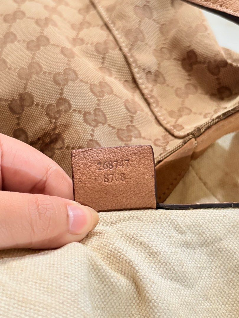 Gucci Monogram Canvas Hobo Shoulder Bag (Category: Luxury Bags & Wallets) located in Caloocan City. Submitted by fierce_mica29 (Listing ID 1460235883, Image 3). Description: - Gucci hobo bag - Beige GG monogram canvas with tan leather trim and straps - Interior: 1 zip pocket, 2 slip pockets - Signs of wear on interior lining and leather - Classic and timeless Gucci design.