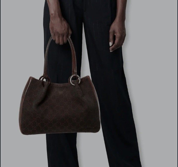 Gucci Monogram Canvas Leather Trim Shoulder Bag (Category: Luxury Bags & Wallets) located in Navotas City. Submitted by riyuwi (Listing ID 1460169528, Image 1). Description: -PREOWNED WellUsed Authentic Vintage Gucci brown Monogram Canvas Leather trim Shoulder bag Small - Classic GG monogram canvas with leather trim - Dark brown color - Interior zip pocket - Silver hardware details -Coded -Zippers all wth Gucci puller handle - Great everyday bag 