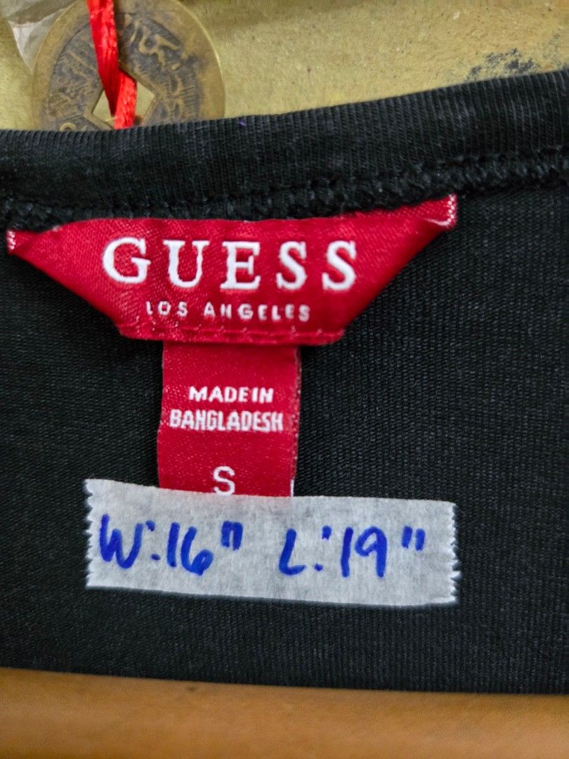 Guess Black Ruched Tie Tank Top Size S (Category: Sleeveless) located in Tarlac. Submitted by resaleclub (Listing ID 1460150569, Image 3). Description: - Stylish Guess tank top - Features flattering ruched detailing on the sides - Adjustable tie closures on the sides - Small, iconic metal Guess logo on the hem - Made in Bangladesh - Measurements: Width 16", Length 19".