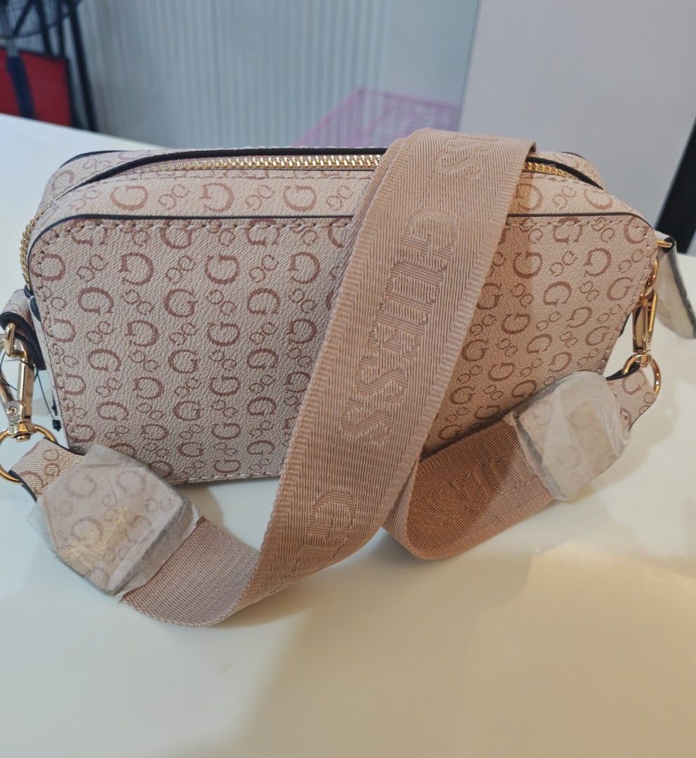 GUESS Crossbody Bag Monogram Pink/Beige (Category: Cross-body Bags) located in Caloocan City. Submitted by det123123 (Listing ID 1460204583, Image 3). Description: Brand new with tags Monogram print design Adjustable GUESS logo strap Gold-tone hardware Zip-top closure Color: Pink/Beige Brand New Perfect for everyday use, travel, or as a gift ✔ Brand new ✔ With original tags ✔ Clean inside and out.