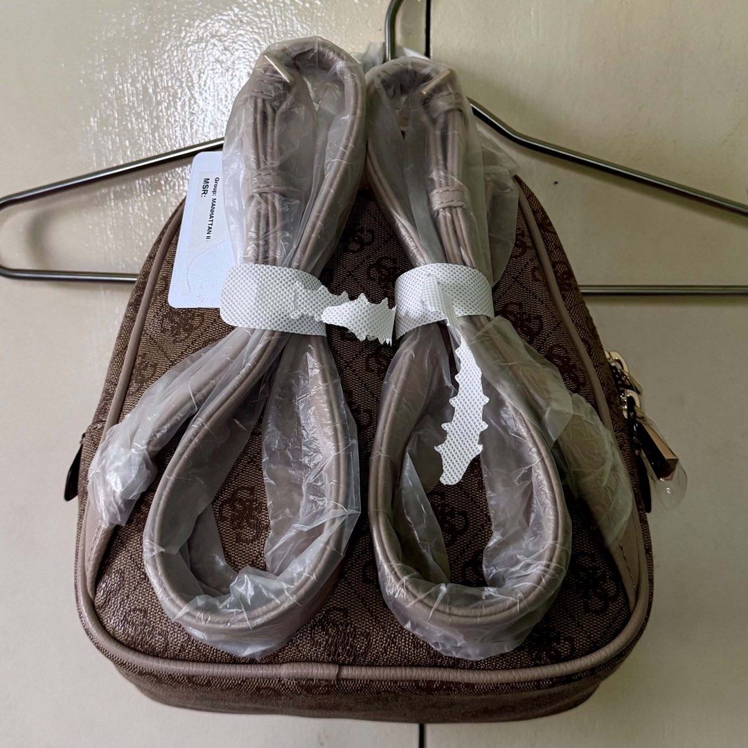 Guess Manhattan II Backpack (Category: Backpacks) located in Makati City. Submitted by jinyoungss (Listing ID 1460226719, Image 2). Description: GUESS Manhattan II Backpack Latte Brand new Zipper and logo with seal With original dustbag.