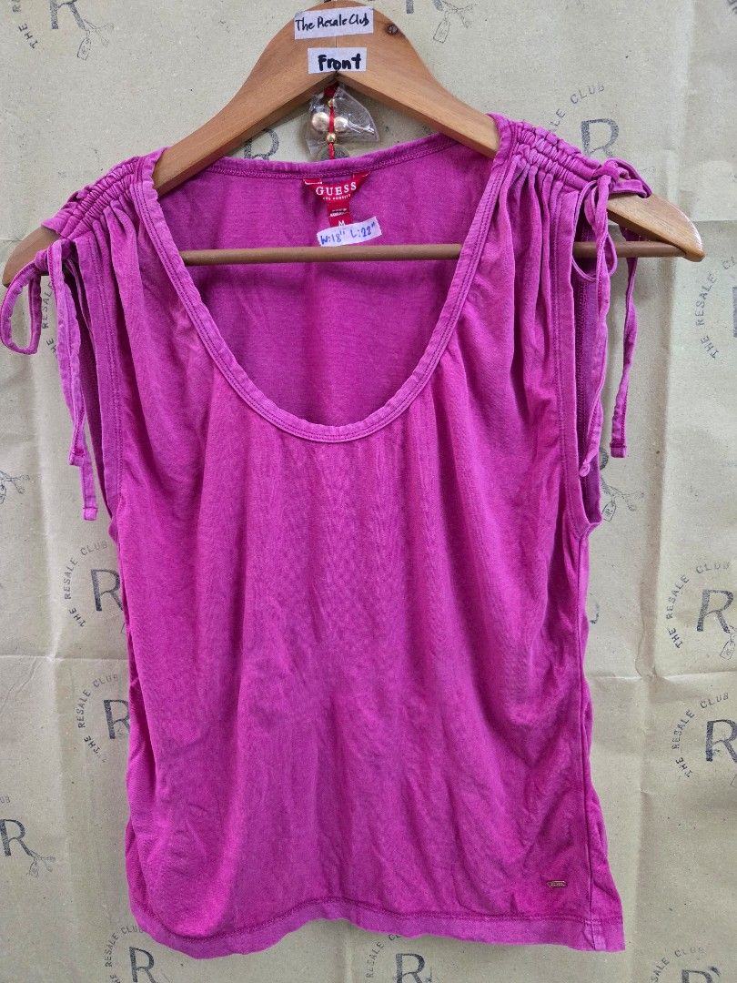 Guess Pink Ruched Tie Strap Top Size M (Category: Sleeveless) located in Tarlac. Submitted by resaleclub (Listing ID 1460150429, Image 1). Description: - Pink Guess top - Size: Medium (M) - Features: Ruched detailing, tie straps - Measurements: Waist 18", Length 22" - Origin: Made in Bangladesh - Style: Great for casual wear.