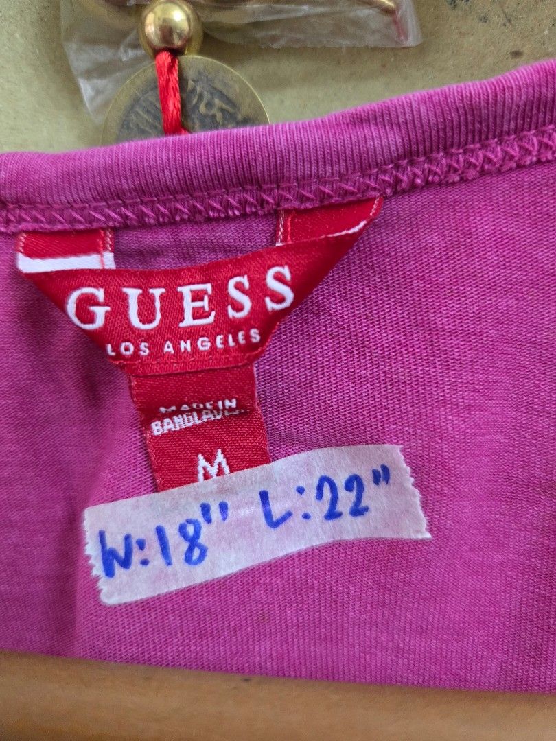 Guess Pink Ruched Tie Strap Top Size M (Category: Sleeveless) located in Tarlac. Submitted by resaleclub (Listing ID 1460150429, Image 3). Description: - Pink Guess top - Size: Medium (M) - Features: Ruched detailing, tie straps - Measurements: Waist 18", Length 22" - Origin: Made in Bangladesh - Style: Great for casual wear.