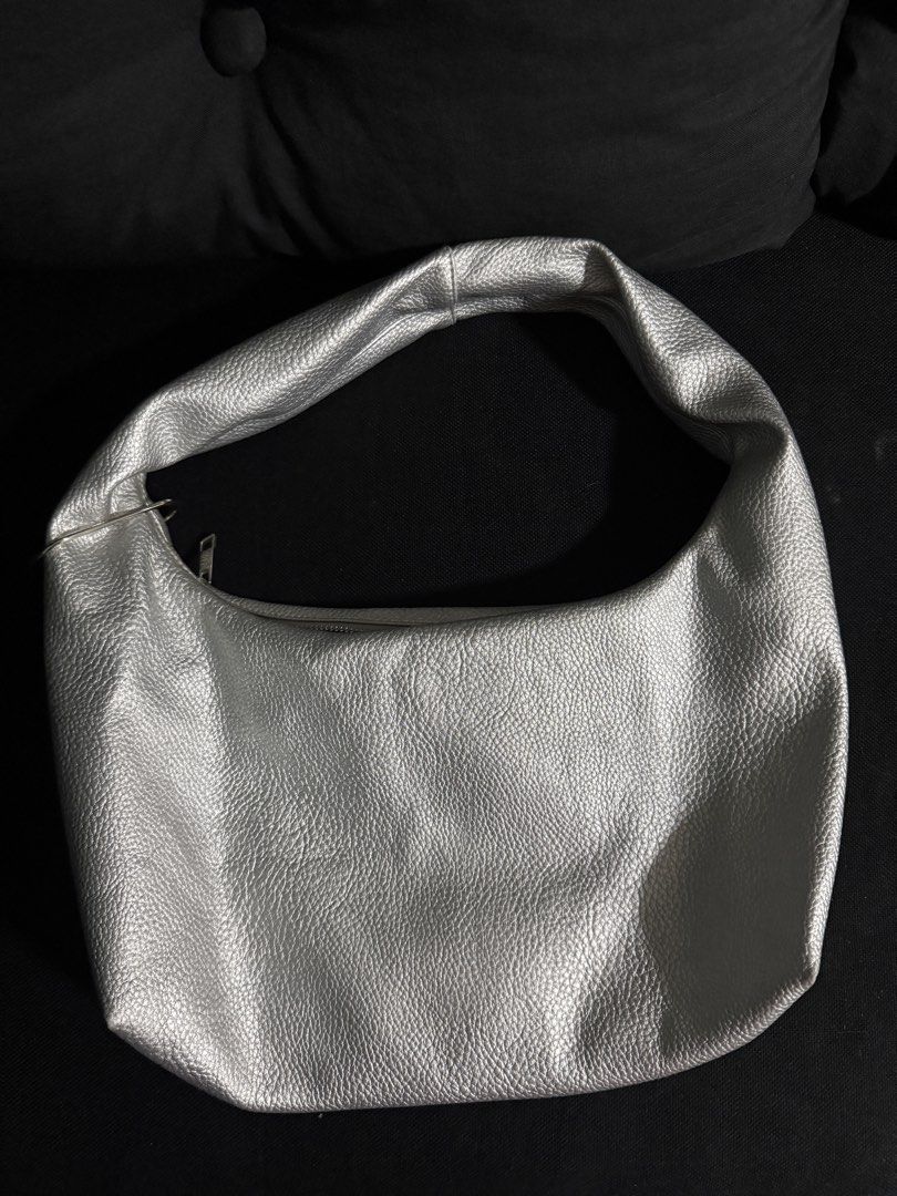 GVN Medium Hobo Bag in Silver (Heavy Pebbled) (Category: Shoulder Bags) located in Makati City. Submitted by _naacy (Listing ID 1460256975, Image 2). Description: FOR SALE GVN MEDIUM HOBO BAG IN SILVER (HEAVY PEBBLED) 🩶🪩 - Bought for 2,200php (slightly nego if sure buyer) - See photos for issues. (Signs of usage & minimal stain only). - Still in good condition since hindi masyado nagagamit. RFS: Not using anymore:(( even if i love it so much, s