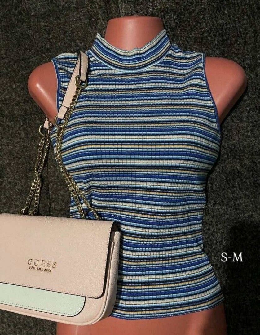 Half turtle neck sleeveless top (Category: Sleeveless) located in Tanza. Submitted by gbpreloved_ (Listing ID 1460192774, Image 1). Description: Fits s-m stretchable fabric.