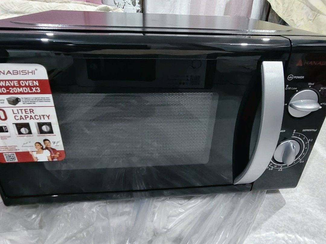 Hanabishi Microwave Oven HMO-20MDLX3 20L (Category: Ovens & Toasters) located in Manila. Submitted by rawna08 (Listing ID 1460194310, Image 3). Description: a week old pa lang. never pa nagamit. RFS: need cash. - Hanabishi Microwave Oven - Model: HMO-20MDLX3 - Capacity: 20 Liters - Features: Timer and Defrost functions - Ideal for: Quick meals and reheating - Condition: Brand new, still in original packaging.
