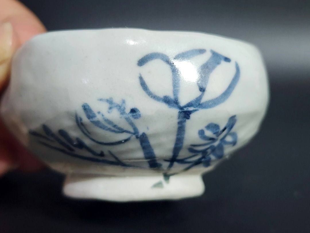 Hand-Painted Blue & White Ceramic Tea Bowl (Category: Vases & Decorative Bowls) located in Quezon City. Submitted by lacasetta (Listing ID 1460245776, Image 3). Description: Charming hand-painted East Asian ceramic tea bowl / small cup featuring an irregular scalloped rim and a simple blue underglaze floral motif. The restrained blue-and-white palette, organic form, and expressive brushwork evoke the character of traditional East Asian folk ceram