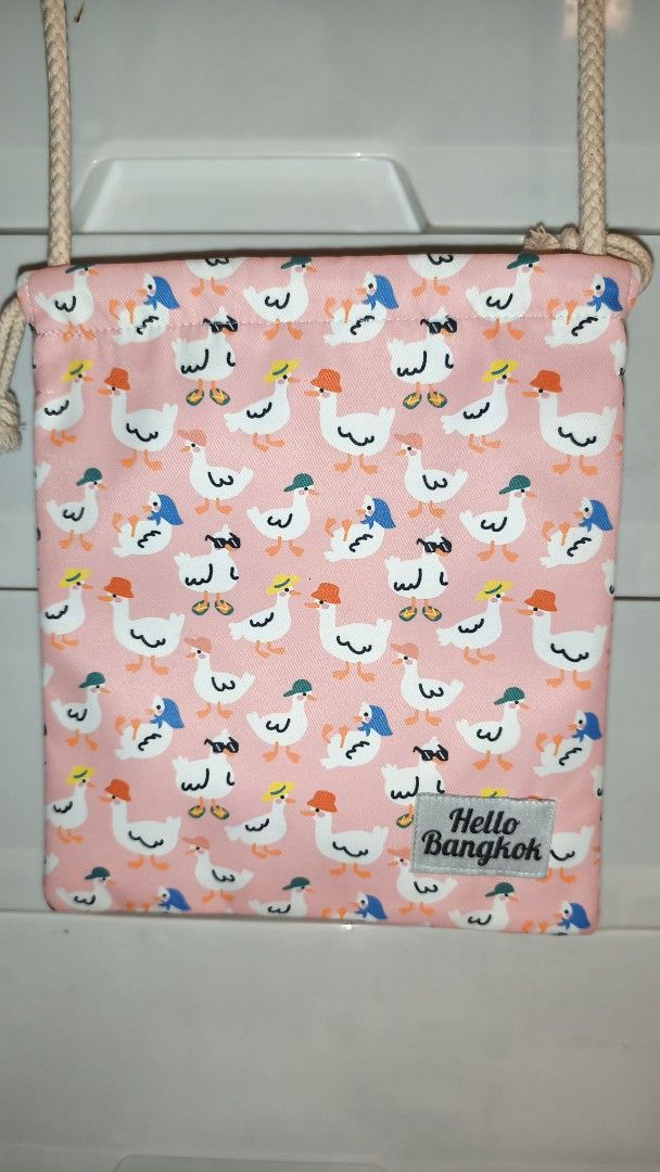 Hello Bangkok Pink Duck Print Drawstring Bag (Category: Cross-body Bags) located in Manila. Submitted by jucelle (Listing ID 1460246779, Image 1). Description: Hello Bangkok Drawstring Bag 8x9.5 inches Strap: 25inches Brand New Bought in Thailand P200 only!.