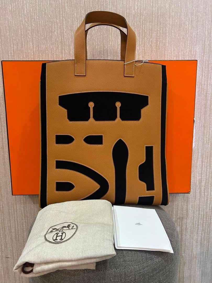 Her mes Petit H Vertical Skeleton Tote Bag (Category: Luxury Bags & Wallets) located in Manila. Submitted by bagislifeshop (Listing ID 1460234352, Image 1). Description: ▪️Her mes Petit H Vertical Skeleton Tote Bag ▪️ ☑️Available in Pampanga ✅Condition: 8.8/10 ✅Colour: Gold and Black ✅Material: Wool and Epsom ✅Inclusion: Dustbag and box .