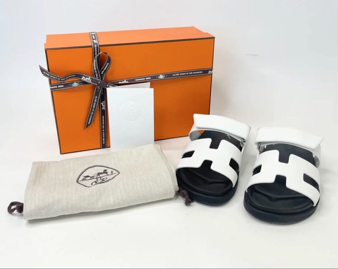 HERMES CHYPRE SANDAL IN WHT LEA. (Category: Flats & Sandals) located in Cainta. Submitted by oohnaiane (Listing ID 1460295371, Image 2). Description: SZ 38.5 Condition: 9.5/10. Excellent condition. Minor sign of wear. Size: 38.5 Accessories: Full Set + Receipt.