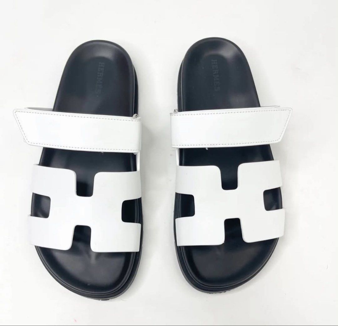 HERMES CHYPRE SANDAL IN WHT LEA. (Category: Flats & Sandals) located in Cainta. Submitted by oohnaiane (Listing ID 1460295371, Image 1). Description: SZ 38.5 Condition: 9.5/10. Excellent condition. Minor sign of wear. Size: 38.5 Accessories: Full Set + Receipt.