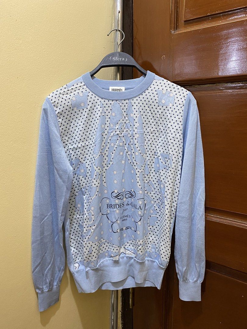 Hermes Paris Brides de Gala Blue Sweater Size M (Category: Coats, Jackets and Outerwear) located in Manila. Submitted by haveago0dthrift (Listing ID 1460149557, Image 2). Description: - Hermes Paris sweater - Size: Medium (M) - Iconic Brides de Gala print on the front - Light blue knit sleeves and back - Care Instructions: Hand wash only, do not bleach or tumble dry - Made in China - Width 17 - Length 23.