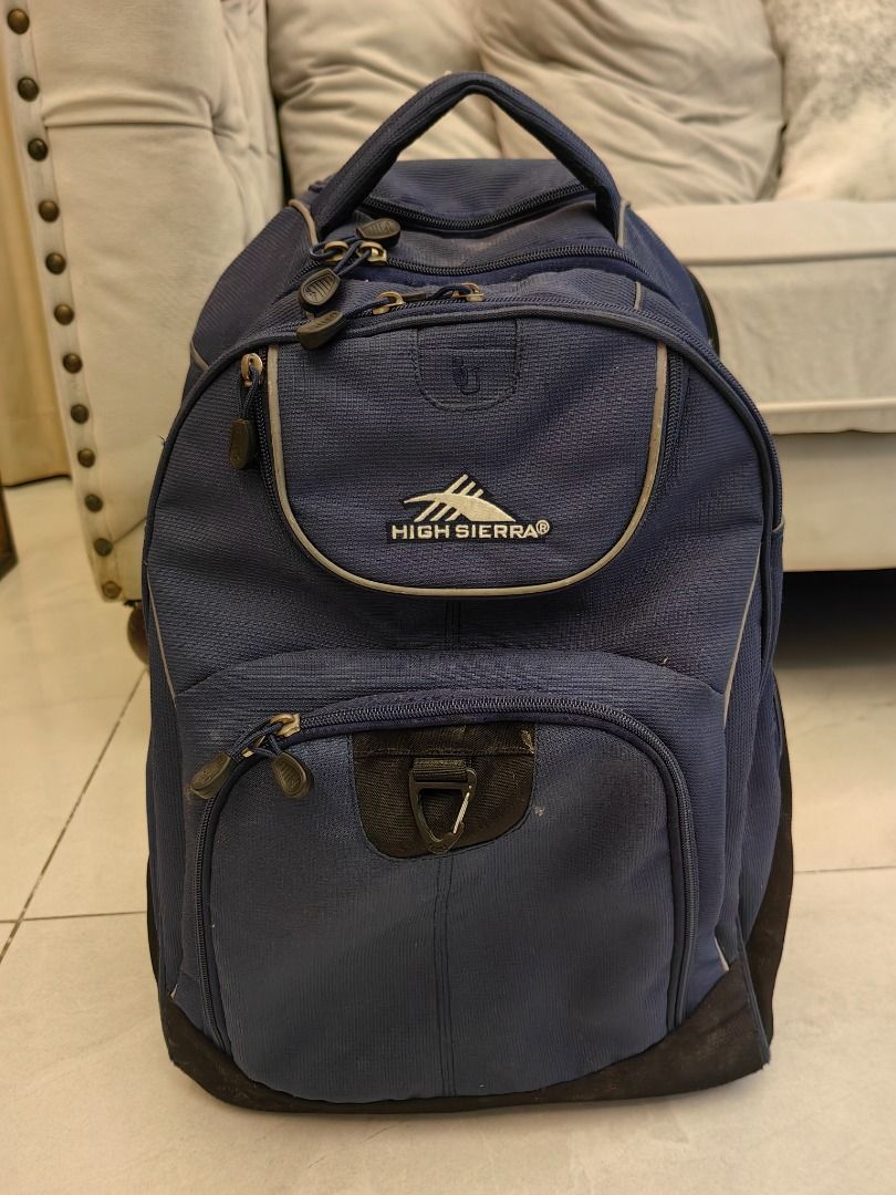 High Sierra Navy Blue Stroller Bag (Category: Backpacks) located in Manila. Submitted by clevertree.70f0b5 (Listing ID 1460194543, Image 1). Description: - Navy blue High Sierra Stroller Bag - Multiple compartments and pockets for ample storage - Zippers are in good working condition - Minor scuffs on the front pocket and bottom corners - Perfect for school.