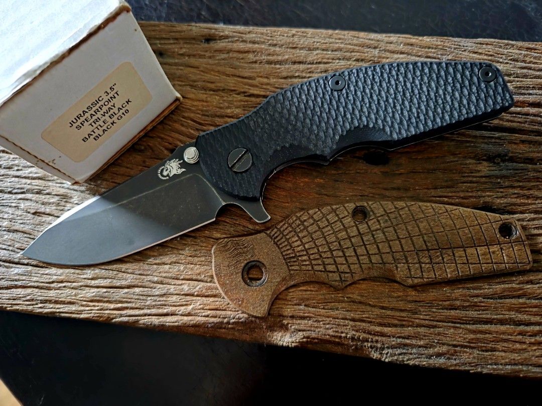 Hinderer Jurassic Battle Black 20CV (Category: Home Improvement Tools & Accessories) located in Marikina City. Submitted by knifeandtoolphilippines (Listing ID 1460177516, Image 1). Description: Fixed Price No Trades Walnut Wood Scale included Missing extra washers with Box.
