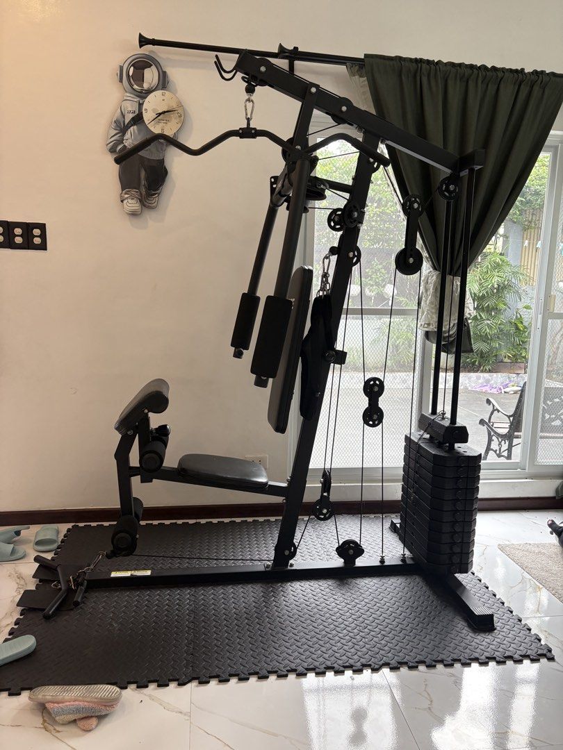 Home Gym Machine with Weight Stack (Category: Cardio & Fitness Machines) located in Quezon City. Submitted by ilonajanecabutotan49.49 (Listing ID 1460126467, Image 2). Description: - Complete home gym setup - Includes weight stack for resistance training - Suitable for lat pulldowns, chest presses, leg extensions, and more - Compact design, ideal for home use - Build strength and tone muscles - Ready for your home workouts.