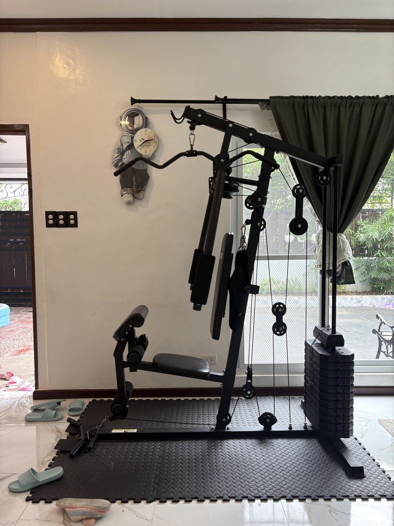 Home Gym Machine with Weight Stack (Category: Cardio & Fitness Machines) located in Quezon City. Submitted by ilonajanecabutotan49.49 (Listing ID 1460126467, Image 1). Description: - Complete home gym setup - Includes weight stack for resistance training - Suitable for lat pulldowns, chest presses, leg extensions, and more - Compact design, ideal for home use - Build strength and tone muscles - Ready for your home workouts.