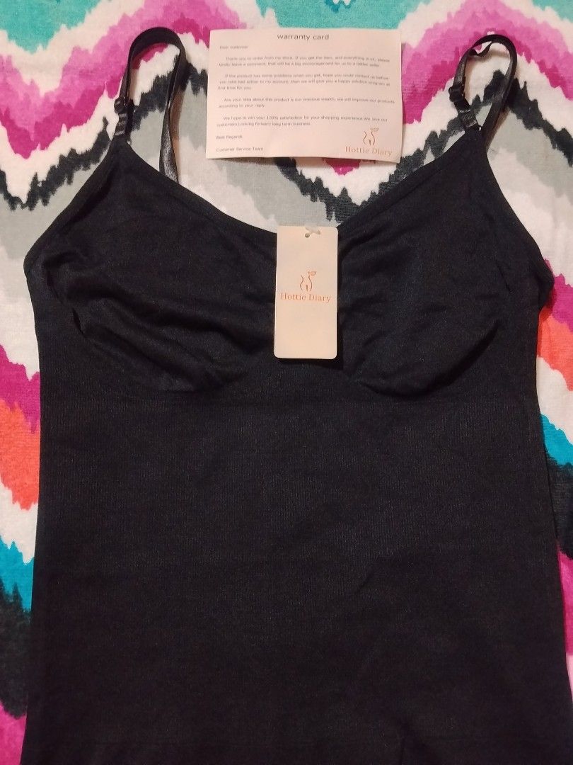 Hottie Diary Black Bodysuit Shapewear (Category: Undergarments & Loungewear) located in Las Pinas. Submitted by budgetbuddies (Listing ID 1460278280, Image 2). Description: - Brand: Hottie Diary - Color: Black - Features: Adjustable straps, hook-and-eye closure at the bottom - Benefits: Offers shaping and smoothing, perfect for layering - Condition: Brand new with original tags and warranty card.