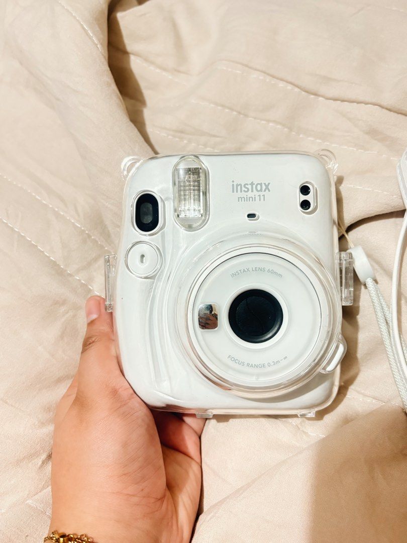 Instax Mini 11 (Category: Cameras) located in Caloocan City. Submitted by _jessicuhm (Listing ID 1460286566, Image 3). Description: Hi! Selling my Instax Mini 11 in Ice White 🤍 rfs: decluttering and switching to digicam na lang - fully functional, and ready to use but w minor scratches - w 2 batteries included - w free clear case & white sling case - negotiable - lady owned - no box - bought it for ₱4,000 - mop: gcash, maribank, gotyme.