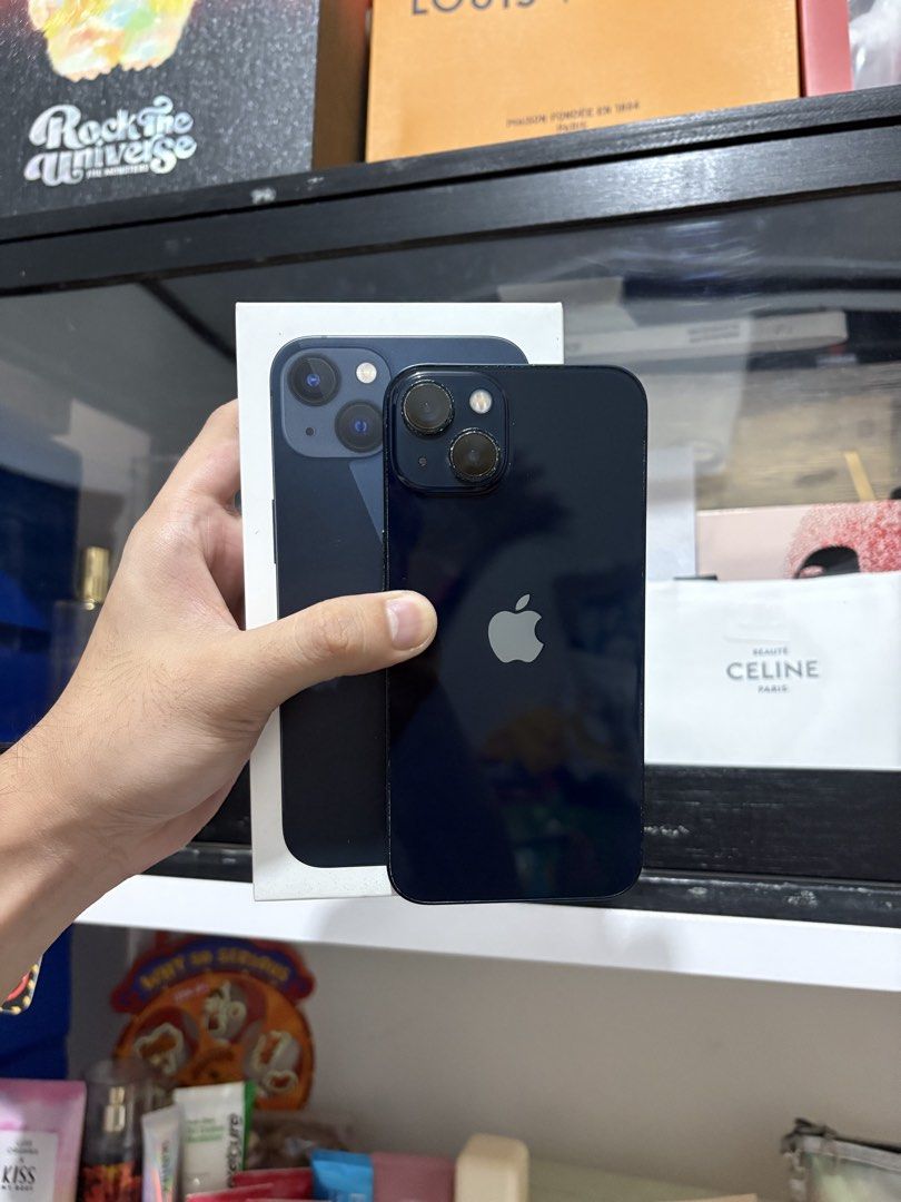 iphone 13 midnight black (Category: iPhone 13 Series) located in General Trias. Submitted by iiamjh (Listing ID 1460277584, Image 2). Description: FOR SALE: iPhone 13 📱 ABENSON Purchased ✅ I’m selling it for only ₱16500 only ‼️ • Color: Midnight/Dark Blue • 128 GB & 84 battery health • any sim ✅ • Still in good working condition✅ • Camera and buttons are working✅ • Smooth performance and great for daily use✅ • With orig box and cord ✅ • Full cer