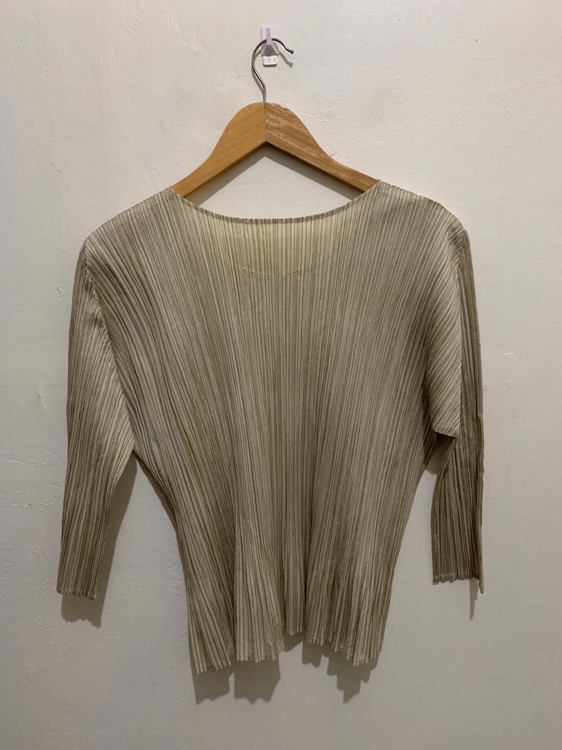 Issey Miyake Pleats Please Top Size 4 (Category: Blouses) located in Cainta. Submitted by mars_olavere (Listing ID 1460215169, Image 2). Description: - Authentic Issey Miyake Pleats Please Top - Made in Japan - Size: 4 - Material: 100% Polyester - Color: Neutral Beige/Khaki - Features signature pleats for unique texture and drape - Highly versatile for layering or standalone wear - width 19 Length 22 Shoulder 15 inch Sleeve 17 inch.