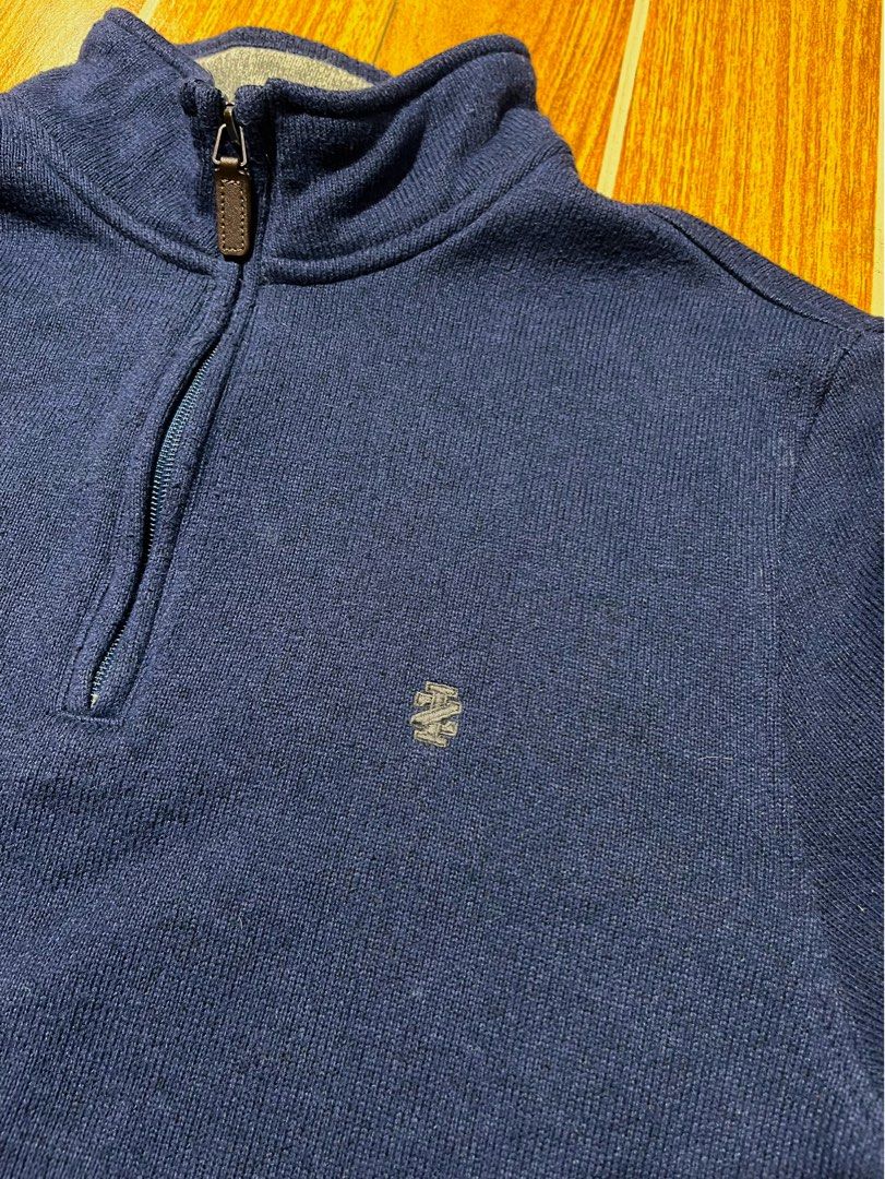 IZOD quarter-zip sweater (Category: Coats, Jackets and Outerwear) located in Lucena. Submitted by mjaothrift (Listing ID 1460260339, Image 3). Description: navy blue quarter-zip pullover sweater from the brand IZOD. It features a ribbed high collar, a silver metal zipper with a brown faux-leather pull tab, and a contrasting gray inner collar lining. Size Medium 20 x 24 inches no issue, need wash .