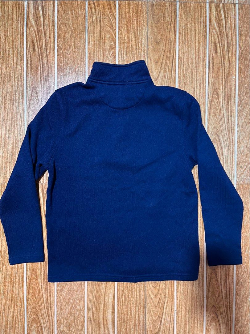 IZOD quarter-zip sweater (Category: Coats, Jackets and Outerwear) located in Lucena. Submitted by mjaothrift (Listing ID 1460260339, Image 2). Description: navy blue quarter-zip pullover sweater from the brand IZOD. It features a ribbed high collar, a silver metal zipper with a brown faux-leather pull tab, and a contrasting gray inner collar lining. Size Medium 20 x 24 inches no issue, need wash .