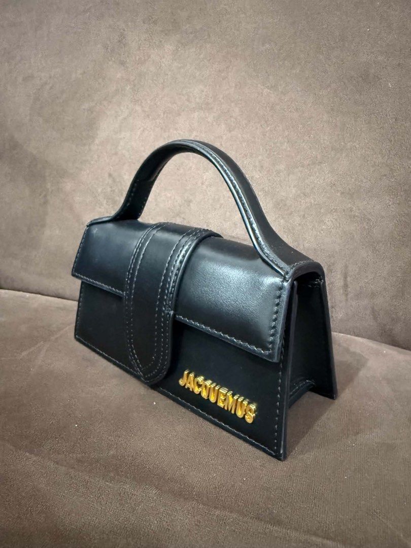 Jacquemus Black Leather Mini Bag (Category: Luxury Bags & Wallets) located in Manila. Submitted by ilvoelv (Listing ID 1460214951, Image 1). Description: - Authentic Jacquemus mini bag in black - Made from premium leather - Features a signature gold logo on the front - Elegant top handle design - Compact and small, ideal for carrying essentials.