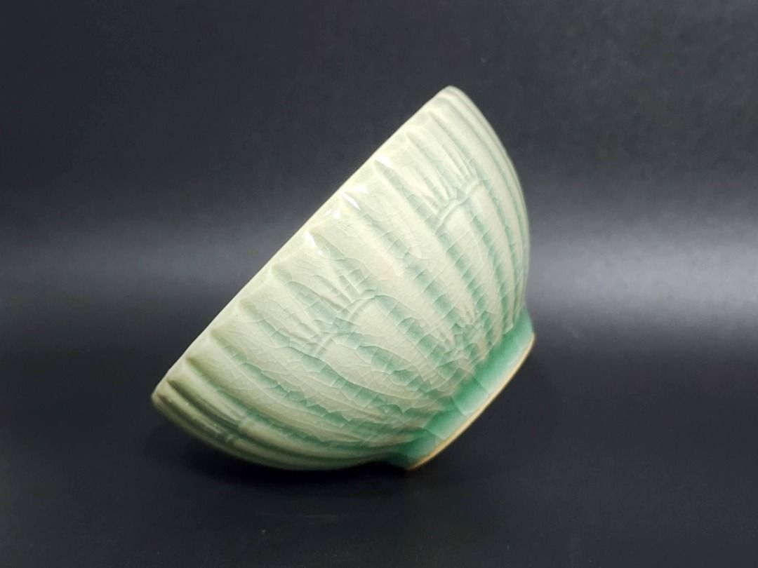 Japanese Celadon Ceramic Bowl — Crackle Glaze (Category: Vases & Decorative Bowls) located in Quezon City. Submitted by lacasetta (Listing ID 1460247637, Image 3). Description: Elegant light-green ceramic bowl with a beautifully developed crackle glaze and vertical fluted relief, evoking the graceful forms of lotus petals and traditional Japanese celadon (seiji). Its soft celadon tone, organic ribbed silhouette, and delicate surface character cre
