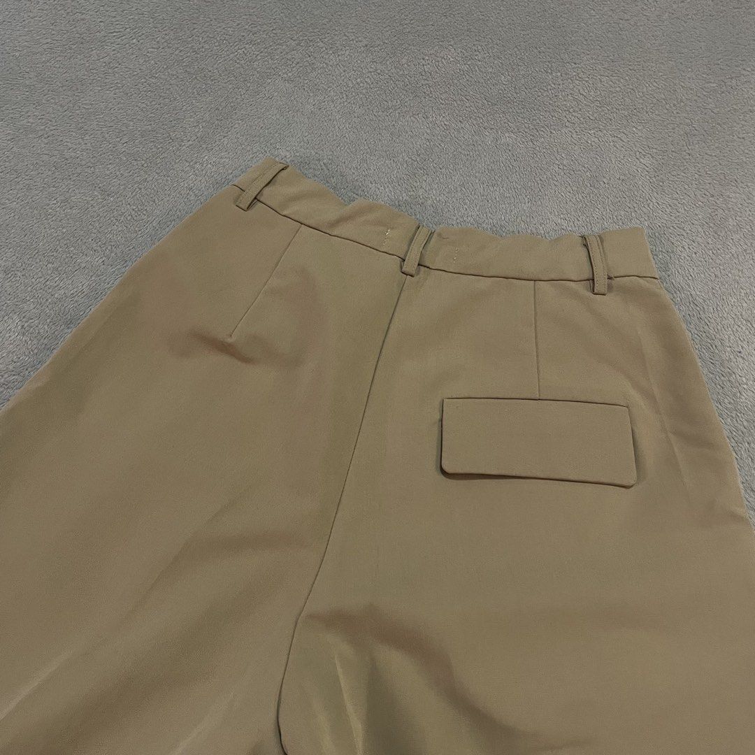 J-Crane Beige Pleated Trousers (Category: Other Bottoms) located in Taguig. Submitted by shopgrocer (Listing ID 1460149980, Image 2). Description: Beige J-Crane trousers, made in Korea. Pleated front, single back pocket, button/zip closure. Perfect for smart casual..