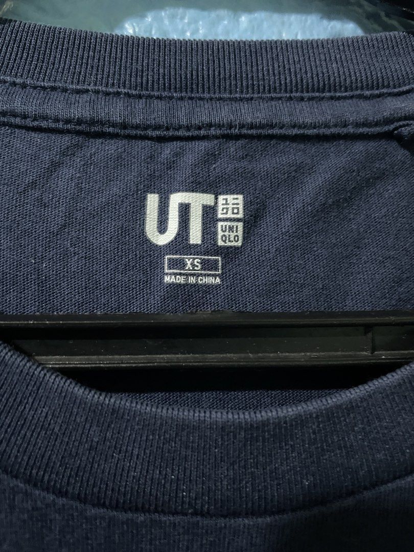 JJK x Uniqlo Collab (Category: Shirts) located in Manila. Submitted by 0702carts (Listing ID 1460146199, Image 3). Description: 🛒 UNIQLO X JJK Collab Shirt - L 23” - W 16.5” ✨ PRELOVED but still in a good condition ❓colors may slightly be different because of lighting. 💰MOP / MOD - Gcash /Maribank - JNT (NO COD) / Lalamove if same day delivery 📍 Location - Sampaloc / Pasig / Cainta.