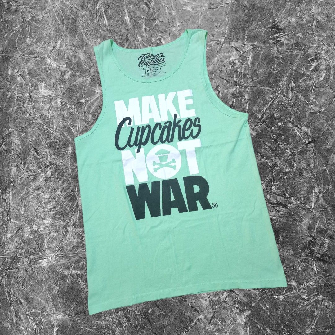 Johnny Cupcakes "Make Cupcakes Not War" Tank Top - Medium (Category: Activewear) located in San Carlos City. Submitted by heverlim (Listing ID 1460116955, Image 1). Description: - Actual Dimension 19W x 28L - Johnny Cupcakes tank top - Features 'Make Cupcakes Not War' graphic - Classic Johnny Cupcakes skull and crossbones cupcake logo - Made of 100% cotton - Ideal for casual wear.