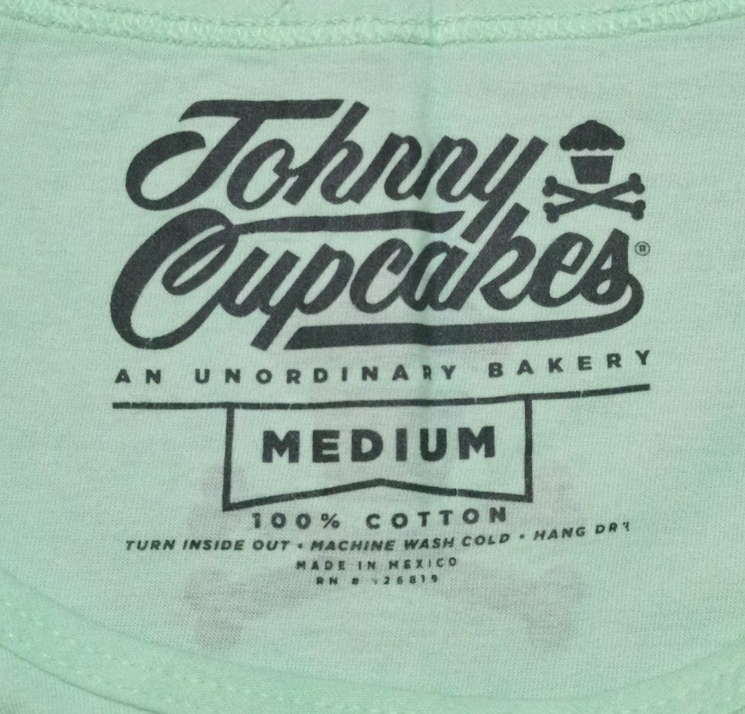 Johnny Cupcakes "Make Cupcakes Not War" Tank Top - Medium (Category: Activewear) located in San Carlos City. Submitted by heverlim (Listing ID 1460116955, Image 2). Description: - Actual Dimension 19W x 28L - Johnny Cupcakes tank top - Features 'Make Cupcakes Not War' graphic - Classic Johnny Cupcakes skull and crossbones cupcake logo - Made of 100% cotton - Ideal for casual wear.