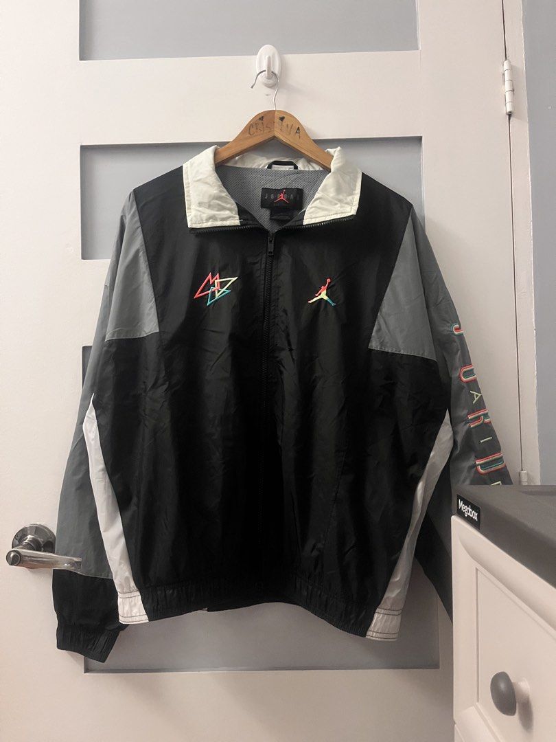 Jordan Windbreaker Jacket (Category: Coats, Jackets and Outerwear) located in Calasiao. Submitted by cristinabarongan5 (Listing ID 1460189820, Image 1). Description: - Black Jordan windbreaker jacket - Features Jumpman logo on front and sleeve - Geometric design on the front - Ideal for casual wear or sports - Size: Medium - Dimention 24 x 27.