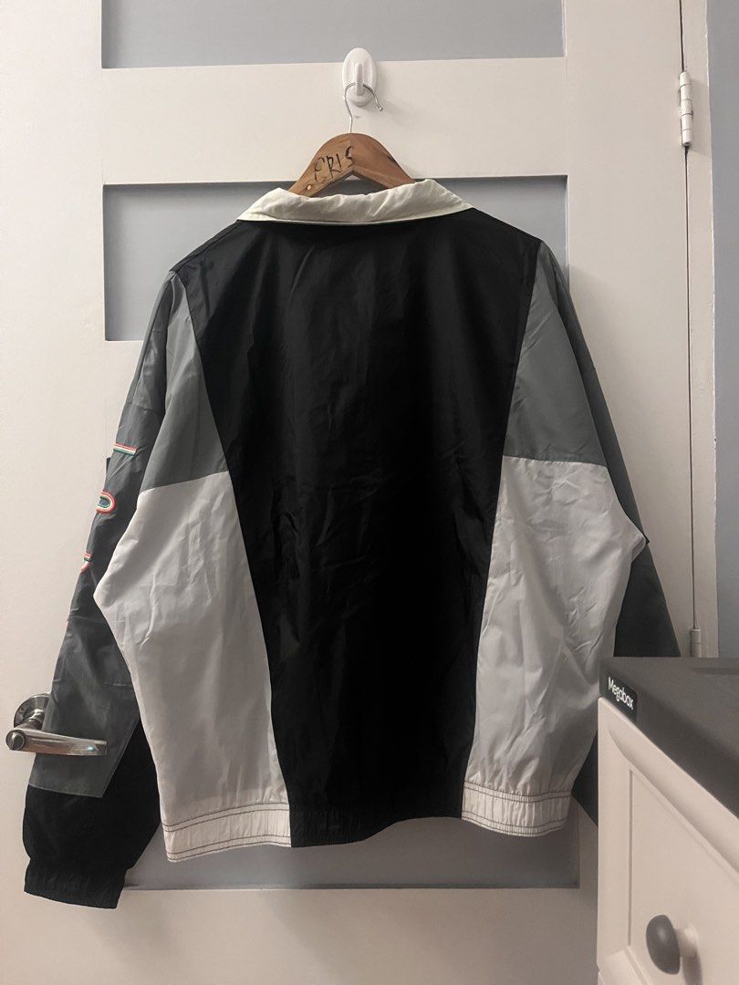 Jordan Windbreaker Jacket (Category: Coats, Jackets and Outerwear) located in Calasiao. Submitted by cristinabarongan5 (Listing ID 1460189820, Image 2). Description: - Black Jordan windbreaker jacket - Features Jumpman logo on front and sleeve - Geometric design on the front - Ideal for casual wear or sports - Size: Medium - Dimention 24 x 27.