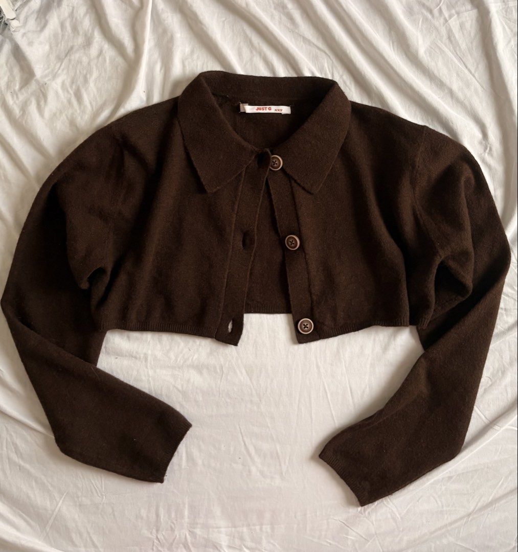 JUST G Brown Cropped Collar Button Down Cardigan (Category: Coats, Jackets and Outerwear) located in Cebu City. Submitted by whiterabbitmint (Listing ID 1458947415, Image 2). Description: - Brown cropped cardigan from JUST G - Comfy material - Fits XS-S - Features a collar - Button-up front - Long sleeves - Versatile for layering over tops or dresses - Can be worn open or closed.