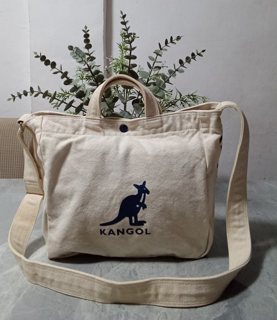 Kangol Canvas Tote Bag (Category: Tote Bags) located in Manila. Submitted by cosmiccloud-9236 (Listing ID 1460208782, Image 1). Description: - Cream colored canvas tote bag by Kangol - Features the iconic kangaroo logo on the front - Equipped with comfortable top handles - Includes a detachable crossbody strap for versatile carrying - Simple, practical, and ideal for everyday use - Great for carrying all your essentials.