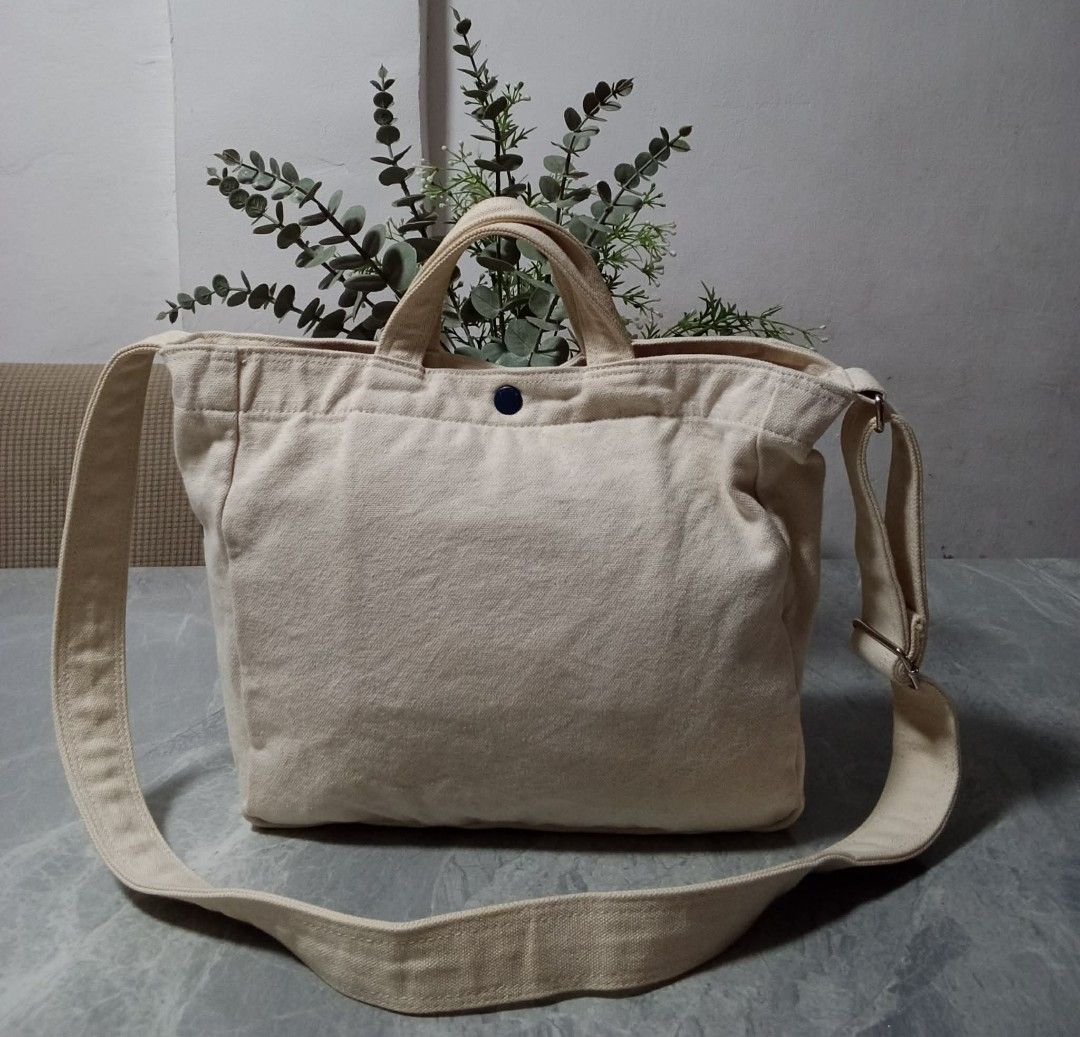 Kangol Canvas Tote Bag (Category: Tote Bags) located in Manila. Submitted by cosmiccloud-9236 (Listing ID 1460208782, Image 2). Description: - Cream colored canvas tote bag by Kangol - Features the iconic kangaroo logo on the front - Equipped with comfortable top handles - Includes a detachable crossbody strap for versatile carrying - Simple, practical, and ideal for everyday use - Great for carrying all your essentials.