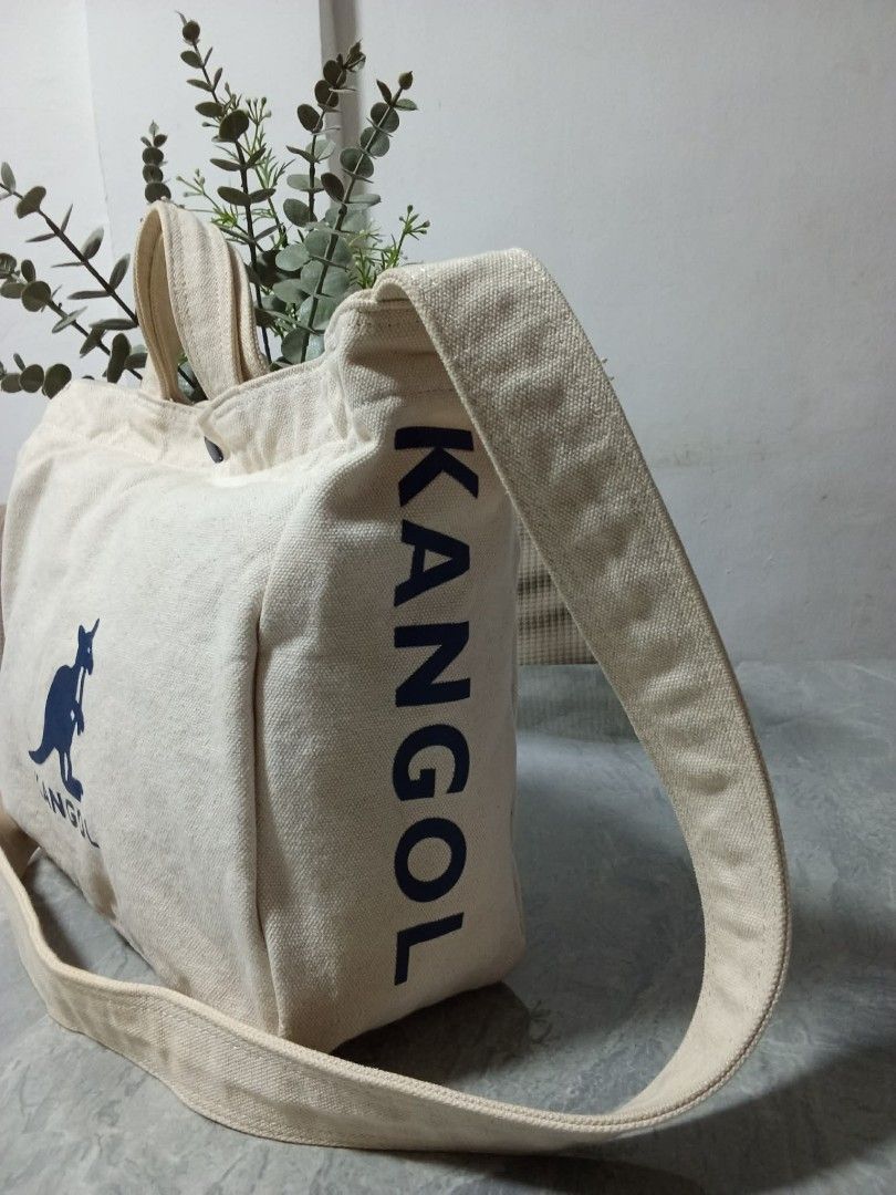 Kangol Canvas Tote Bag (Category: Tote Bags) located in Manila. Submitted by cosmiccloud-9236 (Listing ID 1460208782, Image 3). Description: - Cream colored canvas tote bag by Kangol - Features the iconic kangaroo logo on the front - Equipped with comfortable top handles - Includes a detachable crossbody strap for versatile carrying - Simple, practical, and ideal for everyday use - Great for carrying all your essentials.