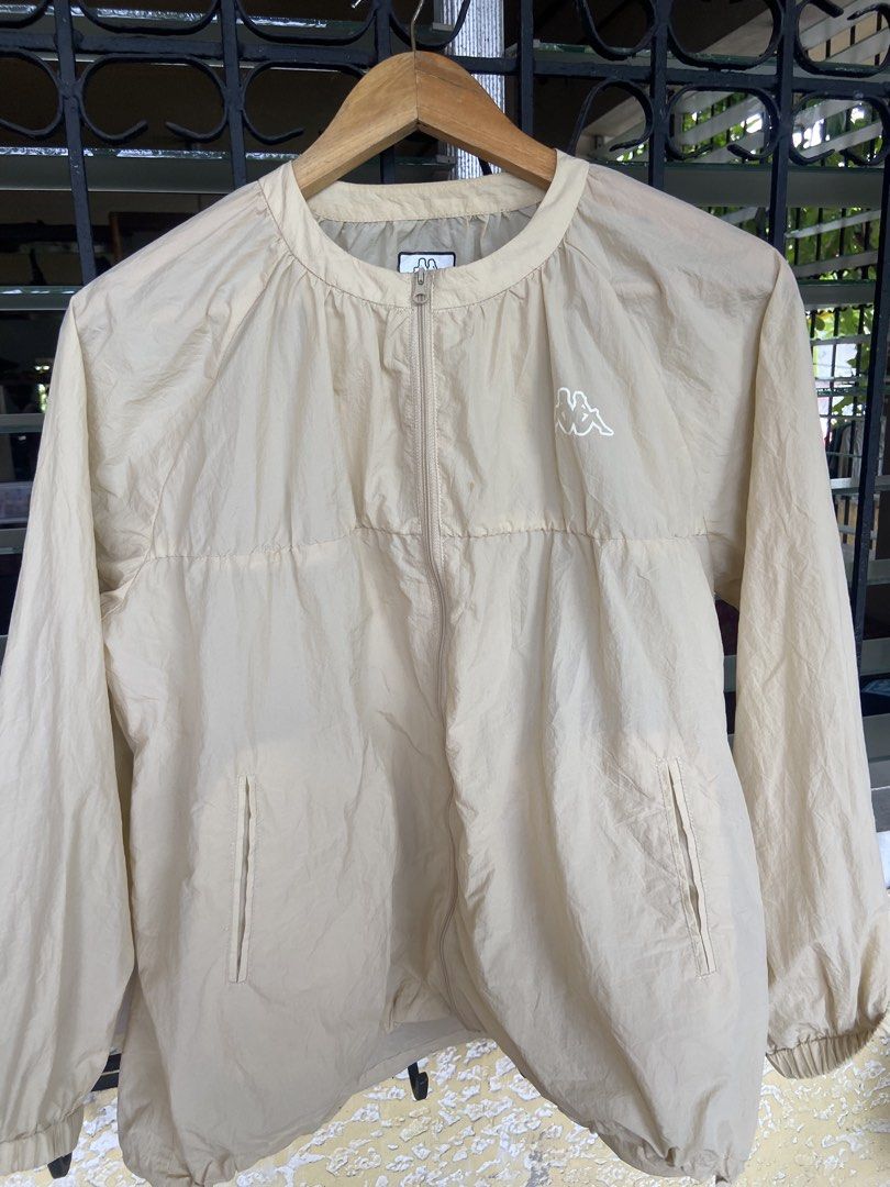 Kappa Beige Track Jacket (Category: Coats, Jackets and Outerwear) located in Manila. Submitted by koolash (Listing ID 1460175586, Image 2). Description: - Lightweight Kappa jacket in neutral beige. - Iconic Kappa logo on chest and neck tag. - Full zip front closure. - Two convenient side pockets. - Elasticated cuffs and hem for a snug fit. - Ideal for layering or everyday casual style..