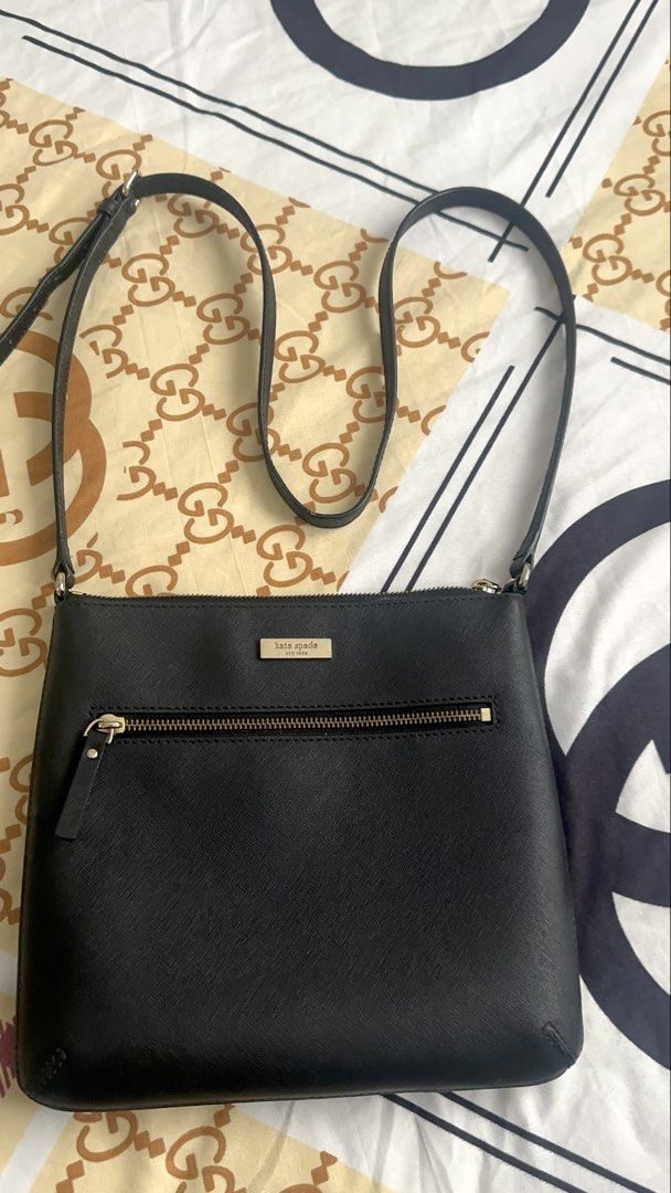 Kate Spade Black Leather Crossbody Bag (Category: Cross-body Bags) located in Manila. Submitted by rachael_23 (Listing ID 1460174398, Image 1). Description: - Authentic Kate Spade crossbody bag in classic black. - Crafted from premium saffiano leather for durability and style. - Convenient front zip pocket for easy access to essentials. - Adjustable strap for comfortable, customized wear. - Timeless and versatile design, ideal for everyday use. -