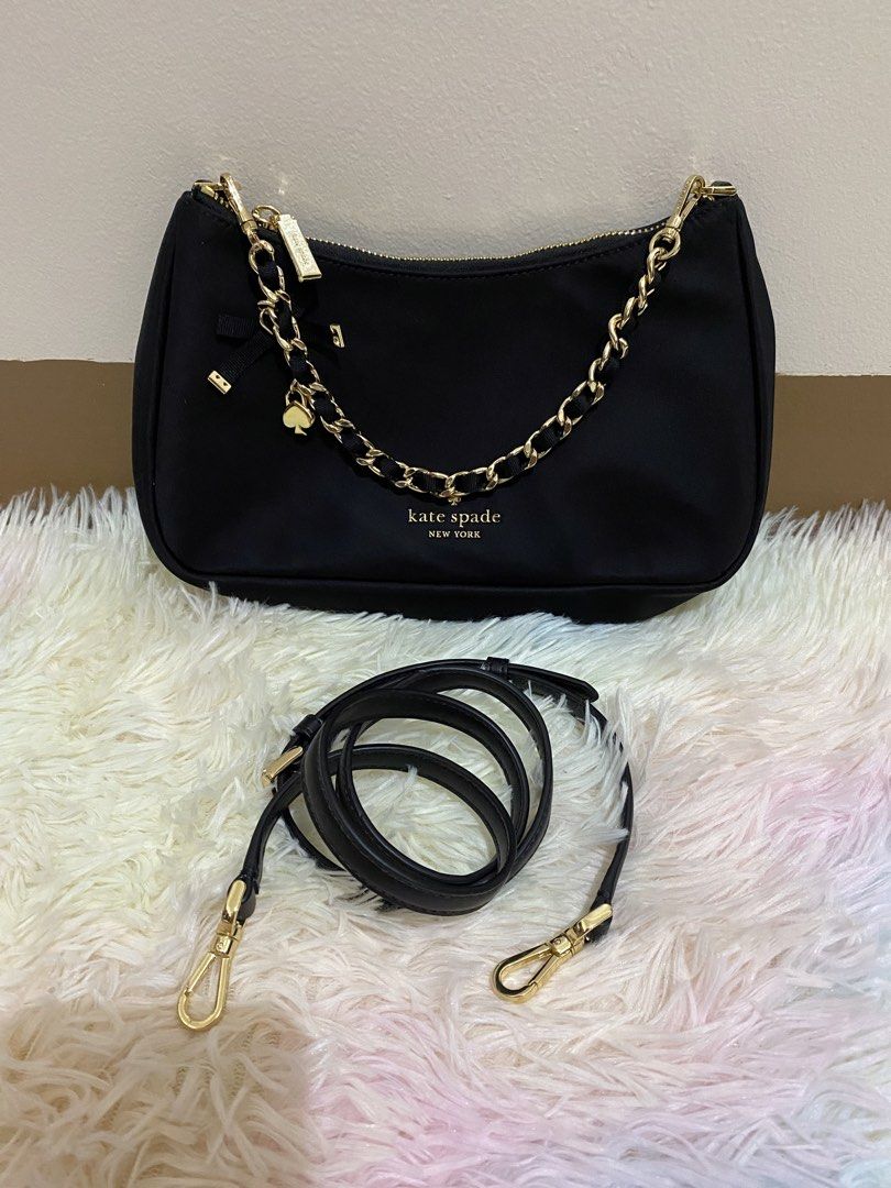 Kate Spade kili/crossbody bag (Category: Cross-body Bags) located in Manila. Submitted by victory_1816 (Listing ID 1460168115, Image 1). Description: Kate Spade Margot nylon convertible crossbody bag. Chic and versatile Kate Spade Margot nylon convertible crossbody bag in classic black, featuring a stylish gold tone chain accent strap and signature spade charm. Selling due to decluttering. I have too many bags, so letting some go instead of keepi