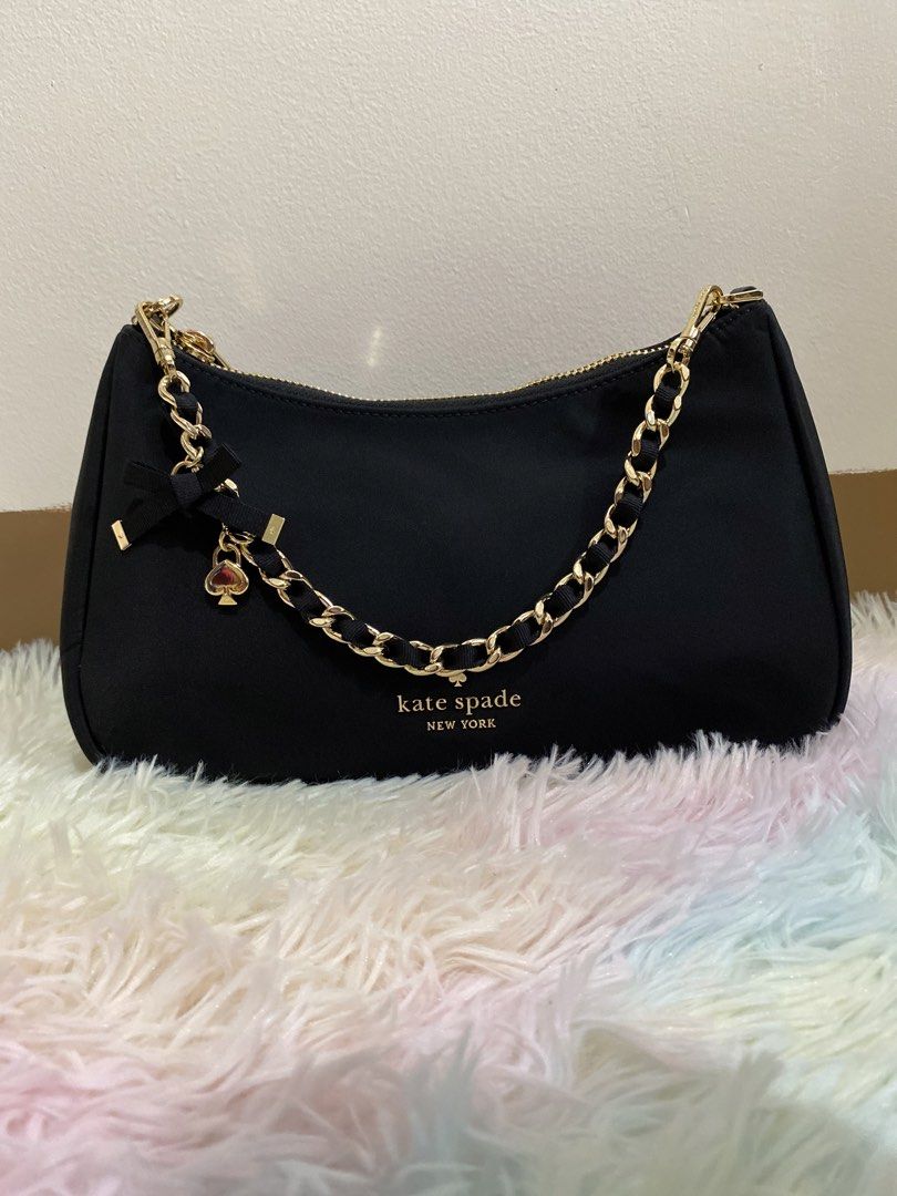 Kate Spade kili/crossbody bag (Category: Cross-body Bags) located in Manila. Submitted by victory_1816 (Listing ID 1460168115, Image 3). Description: Kate Spade Margot nylon convertible crossbody bag. Chic and versatile Kate Spade Margot nylon convertible crossbody bag in classic black, featuring a stylish gold tone chain accent strap and signature spade charm. Selling due to decluttering. I have too many bags, so letting some go instead of keepi