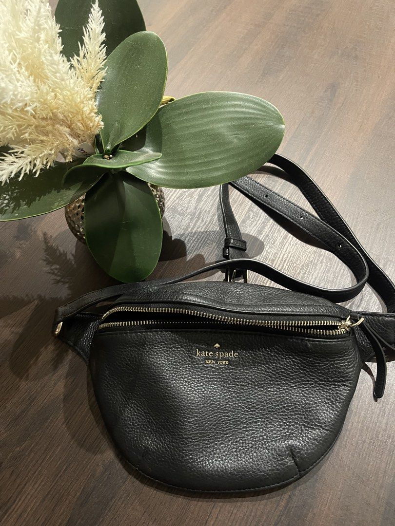 Kate spade leather belt bag (Category: Belt bags, Clutches and Pouches) located in Davao. Submitted by delombarki94549 (Listing ID 1460224744, Image 1). Description: CONDITION 9/10 – Excellent condition, minimal use. DIMENSIONS L 30cm × H 16cm × W 5cm DETAILS Kate Spade New York belt bag crafted from grained black leather with gold-tone hardware. Features a zip closure and adjustable strap for versatile styling — wear it crossbody or around the w