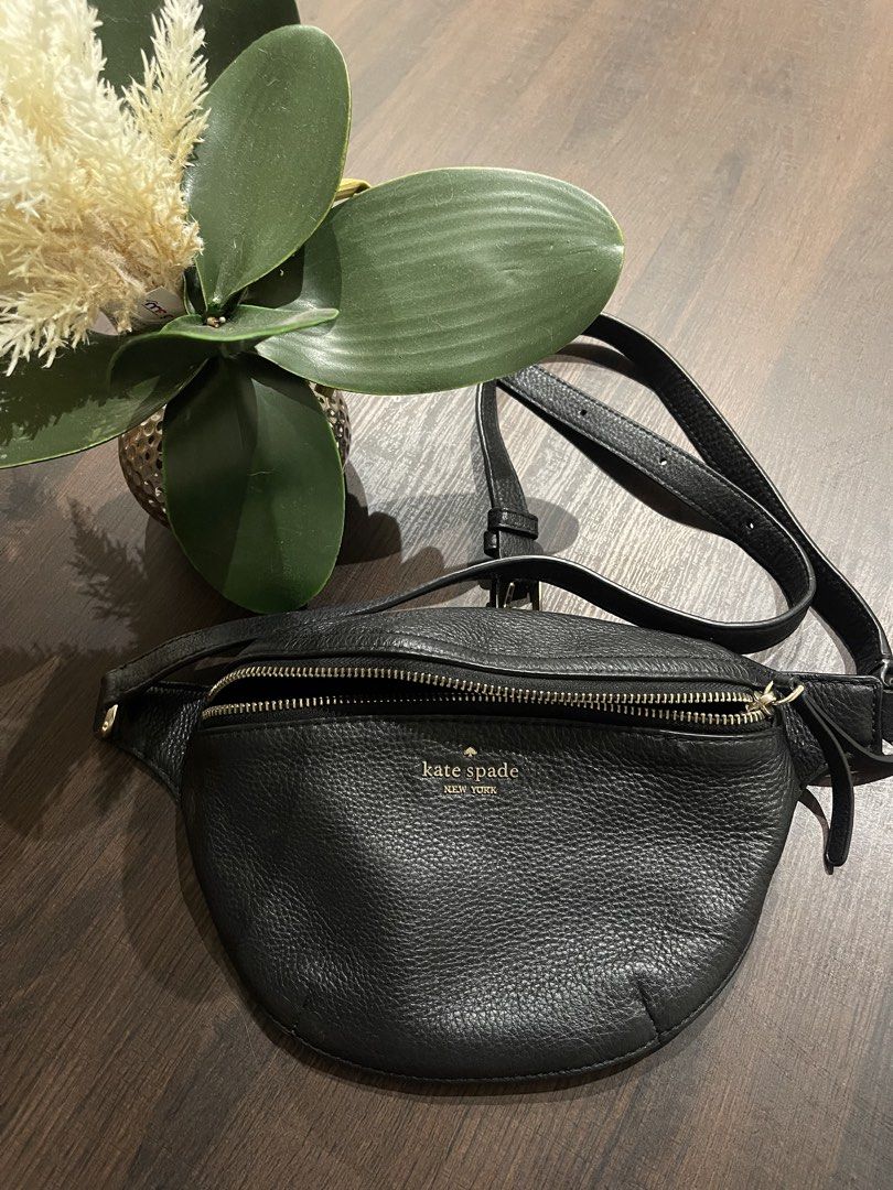 Kate spade leather belt bag (Category: Belt bags, Clutches and Pouches) located in Davao. Submitted by delombarki94549 (Listing ID 1460224744, Image 2). Description: CONDITION 9/10 – Excellent condition, minimal use. DIMENSIONS L 30cm × H 16cm × W 5cm DETAILS Kate Spade New York belt bag crafted from grained black leather with gold-tone hardware. Features a zip closure and adjustable strap for versatile styling — wear it crossbody or around the w