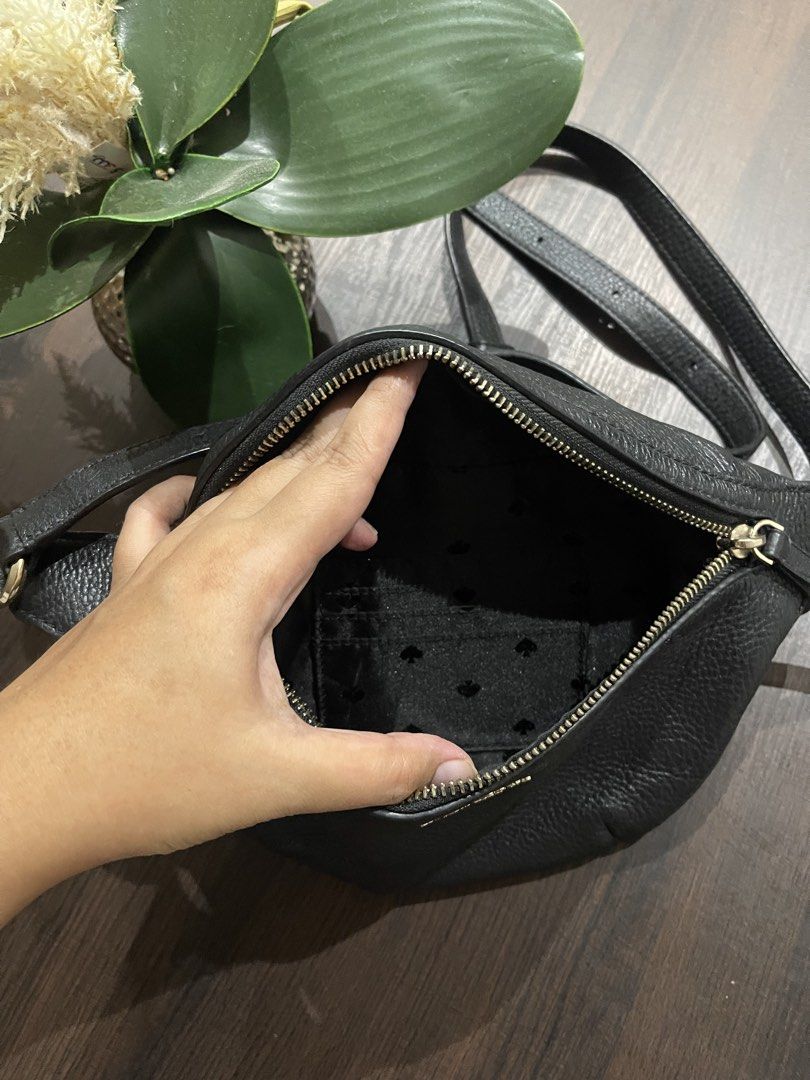 Kate spade leather belt bag (Category: Belt bags, Clutches and Pouches) located in Davao. Submitted by delombarki94549 (Listing ID 1460224744, Image 3). Description: CONDITION 9/10 – Excellent condition, minimal use. DIMENSIONS L 30cm × H 16cm × W 5cm DETAILS Kate Spade New York belt bag crafted from grained black leather with gold-tone hardware. Features a zip closure and adjustable strap for versatile styling — wear it crossbody or around the w