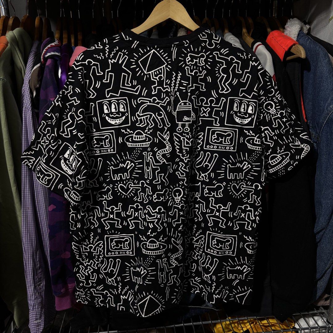 Keith Haring Graphic T-Shirt (Category: Tshirts & Polo Shirts ) located in Caloocan City. Submitted by bonsatocha43876 (Listing ID 1460199838, Image 3). Description: - Authentic Keith Haring graphic tee - Classic black with striking white and neon green all-over print - Measurements: 23 inches width, 26 inches length - Excellent pre-loved condition, ready for its next adventure - Unique statement piece for only 450 pesos.