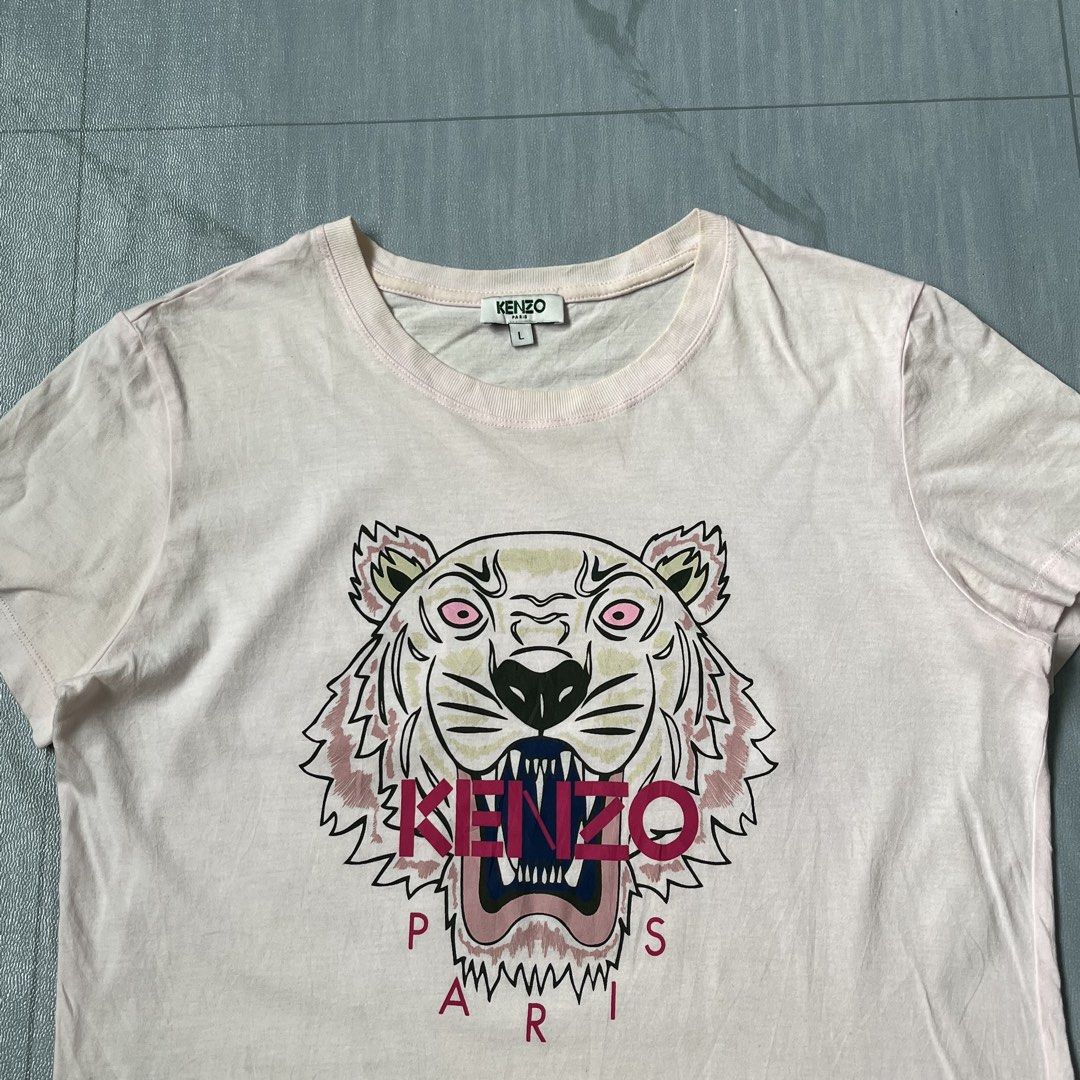 Kenzo Paris Big Logo Tiger (Category: Activewear) located in Cavite. Submitted by newclassicwear (Listing ID 1460171214, Image 3). Description: Size L On Tag 18width 23length Excellent Condition 9.8 Honest Color Rate None Any Issue Kenzo Cotton Tee - Light Pink, Size L. Features iconic tiger print. Perfect for casual style..
