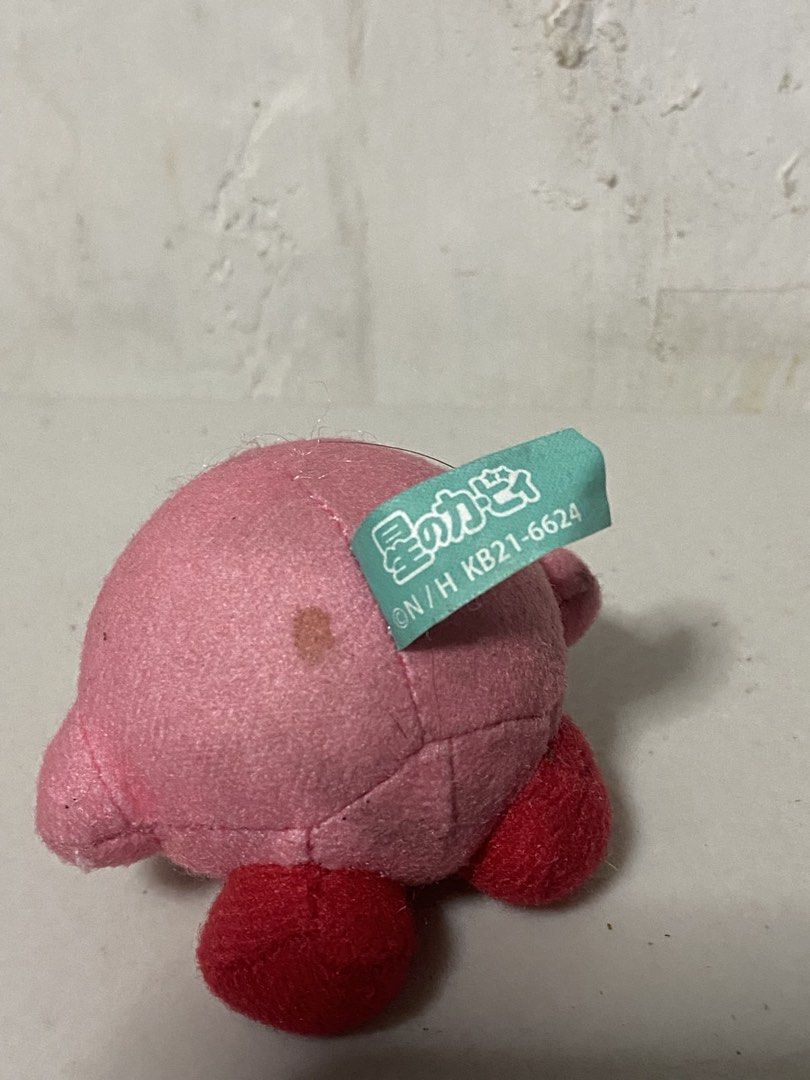 Kirby Plush Toy (Category: Plushies & Soft Toys) located in Manila. Submitted by kuya_moto (Listing ID 1460277899, Image 2). Description: - Adorable pink Kirby plush toy - Compact size, ideal for collecting or display - Features a small brown mark on the back - Original tag is still attached - A must-have for any Kirby enthusiast!.