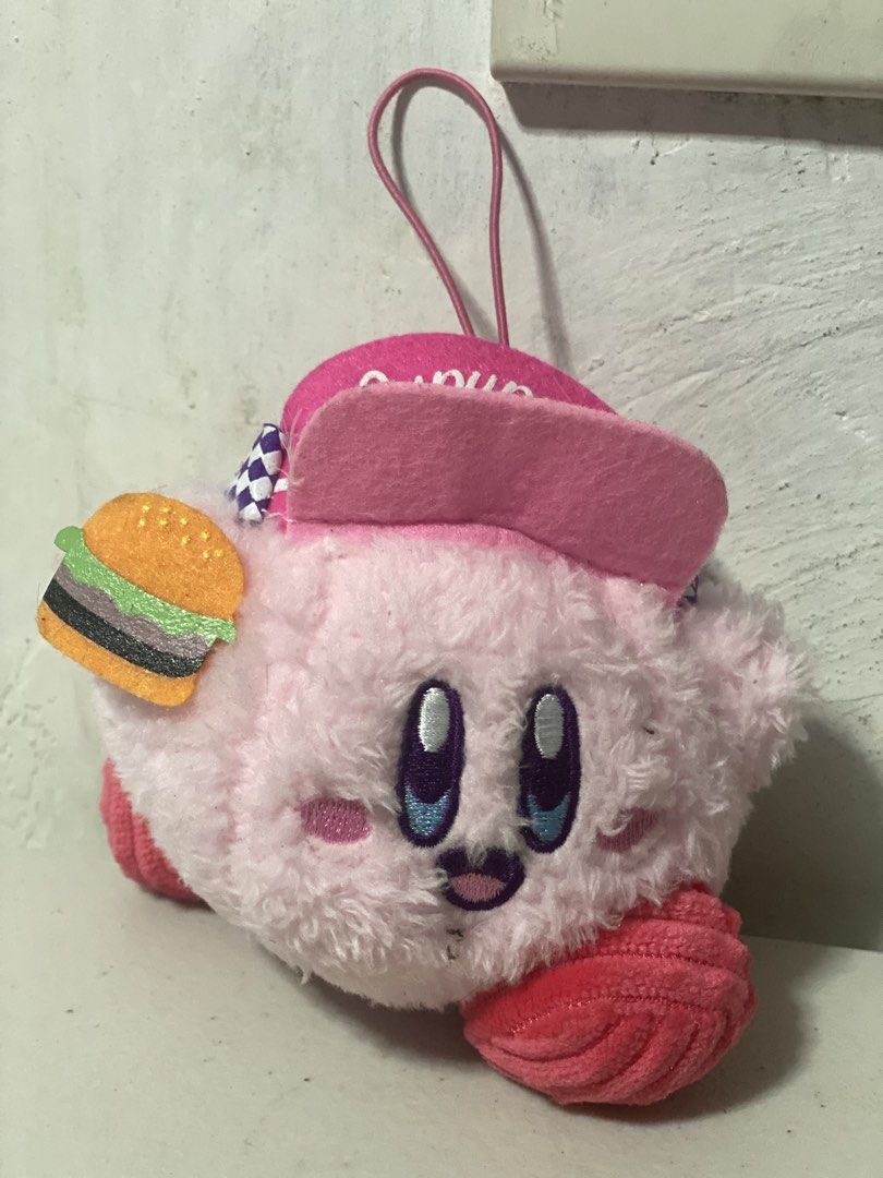 Kirby Plush Toy with Burger Accessory (Category: Plushies & Soft Toys) located in Manila. Submitted by kuya_moto (Listing ID 1460269916, Image 1). Description: - Adorable pink Kirby plush toy - Comes with a cute burger accessory - Features a pink hat and checkered ribbon detail - Made in China - A must-have for any Kirby fan!.